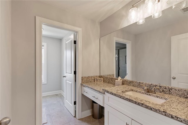 bathroom featuring baseboards and vanity