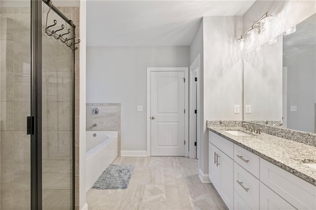 full bathroom featuring a garden tub, a sink, baseboards, a shower stall, and double vanity