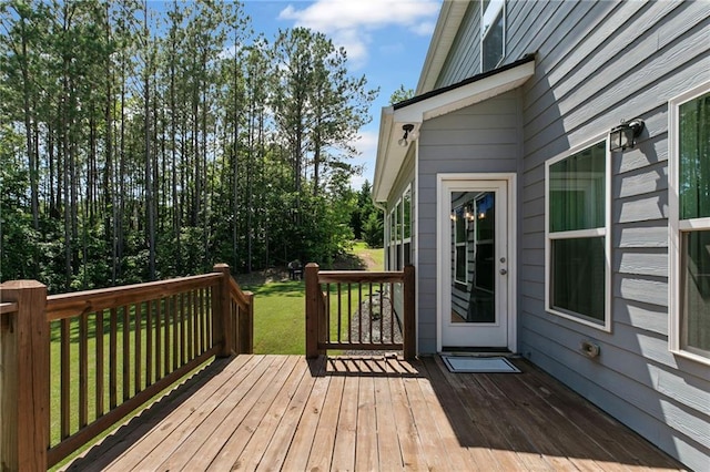 wooden terrace with a yard