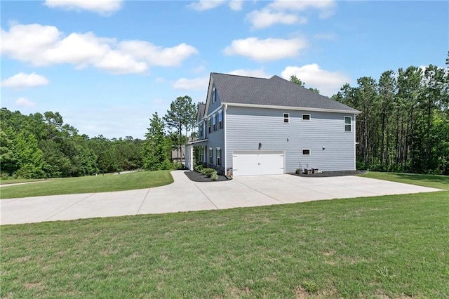 view of home's exterior with driveway, an attached garage, and a lawn