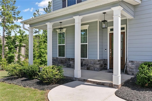 property entrance featuring covered porch