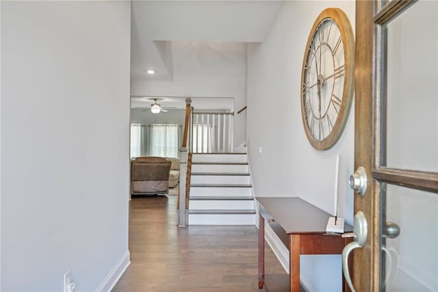 entrance foyer featuring baseboards, a ceiling fan, wood finished floors, stairs, and recessed lighting