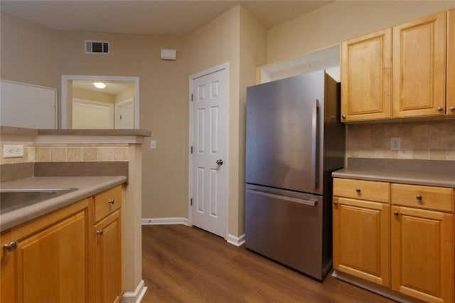 8020 Woodland Ln, Alpharetta, GA 30009 - kitchen featuring freestanding refrigerator, dark wood-type flooring, tasteful backsplash, baseboards, and light countertops