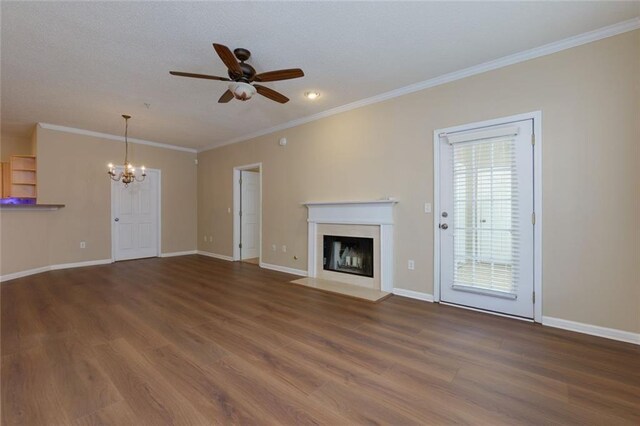 8020 Woodland Ln, Alpharetta, GA 30009 - unfurnished living room with a chandelier, a fireplace with flush hearth, wood finished floors, a ceiling fan, and ornamental molding
