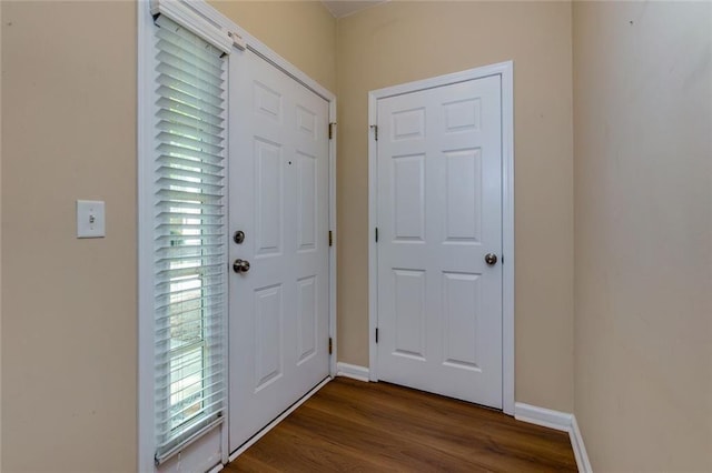 8020 Woodland Ln, Alpharetta, GA 30009 - entryway with dark wood finished floors and baseboards