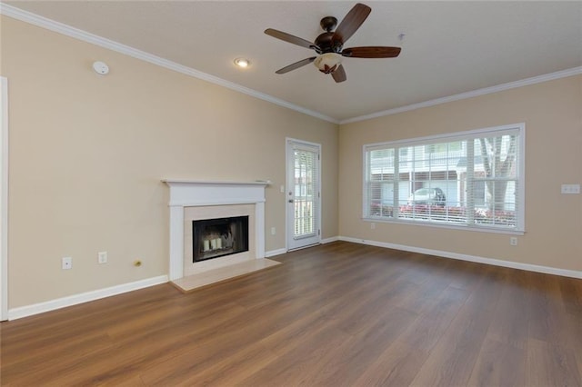 8020 Woodland Ln, Alpharetta, GA 30009 - unfurnished living room featuring wood finished floors, ceiling fan, crown molding, baseboards, and a fireplace with flush hearth