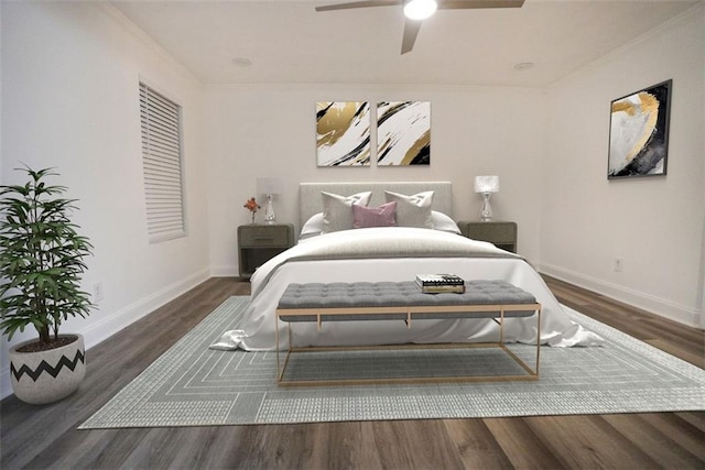 bedroom featuring ceiling fan, dark hardwood / wood-style floors, and ornamental molding