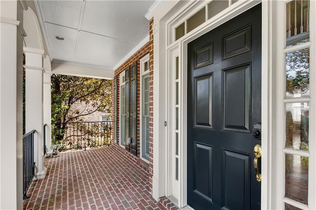 doorway to property featuring a porch