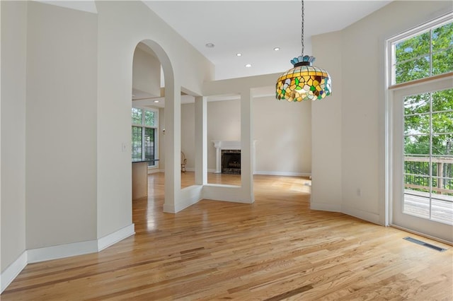 267 Starcross Ln, Jasper, GA 30143 - unfurnished dining area featuring plenty of natural light, light wood finished floors, recessed lighting, a fireplace, and a high ceiling