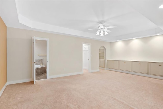 267 Starcross Ln, Jasper, GA 30143 - empty room with a raised ceiling, light carpet, ceiling fan, and baseboards