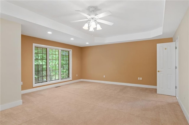 267 Starcross Ln, Jasper, GA 30143 - unfurnished room with light colored carpet, a tray ceiling, recessed lighting, baseboards, and a ceiling fan