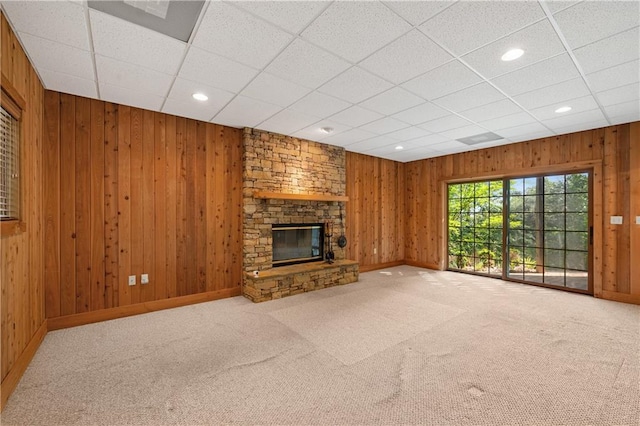 267 Starcross Ln, Jasper, GA 30143 - unfurnished living room featuring baseboards, carpet flooring, a stone fireplace, recessed lighting, and wood walls