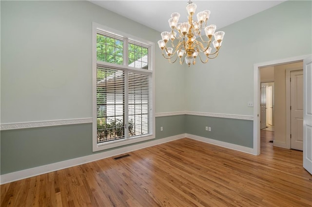 267 Starcross Ln, Jasper, GA 30143 - unfurnished room featuring wood finished floors, a chandelier, and baseboards