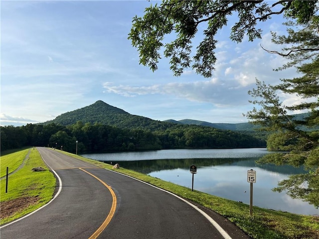 267 Starcross Ln, Jasper, GA 30143 - view of asphalt road featuring a wooded view, a water and mountain view, and traffic signs