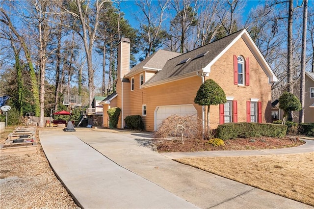 view of side of home with a garage