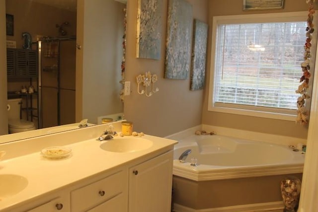 full bathroom with a shower stall, a bath, double vanity, and a sink