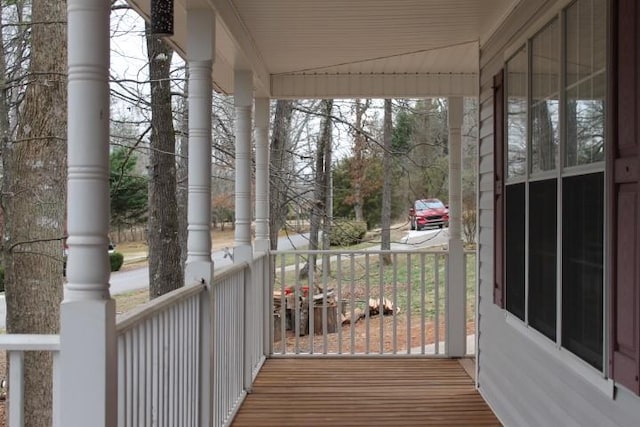 wooden terrace featuring a porch