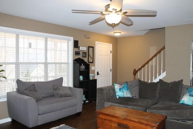 living room featuring stairway and a ceiling fan