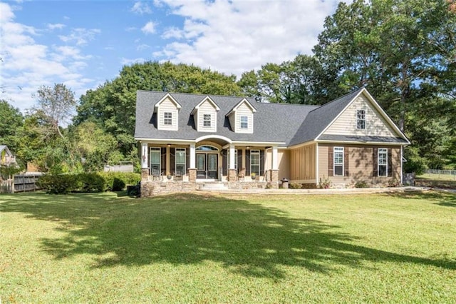 view of front facade featuring a front yard and a porch