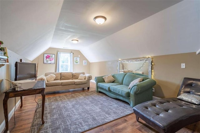 living room with lofted ceiling and hardwood / wood-style floors