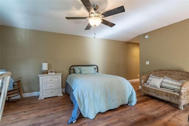 bedroom with ceiling fan and hardwood / wood-style floors