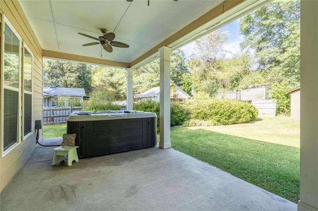 view of patio featuring a hot tub and ceiling fan