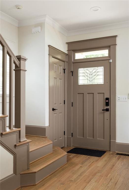 2876 White Oak Dr, Decatur, GA 30032 - entrance foyer with stairs, light wood-style floors, and crown molding