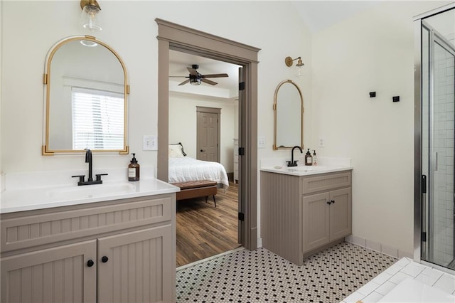 2876 White Oak Dr, Decatur, GA 30032 - ensuite bathroom featuring two vanities, ceiling fan, and a shower stall