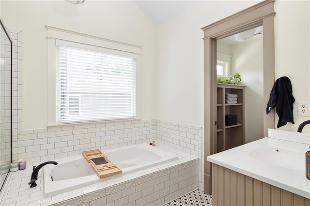 2876 White Oak Dr, Decatur, GA 30032 - bathroom with a bath, vaulted ceiling, tile patterned floors, and vanity