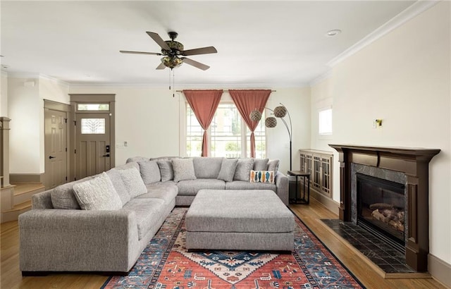 2876 White Oak Dr, Decatur, GA 30032 - living area with crown molding, ceiling fan, wood finished floors, and a fireplace