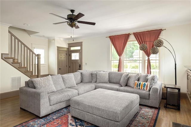 2876 White Oak Dr, Decatur, GA 30032 - living room with crown molding, wood finished floors, ceiling fan, stairs, and baseboards