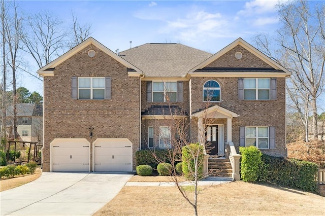 view of front of home with a shingled roof, concrete driveway, brick siding, and an attached garage