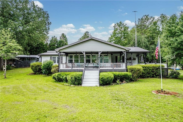 back of house with a lawn and a porch