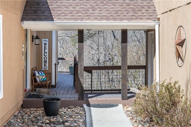 rear view of property featuring stairs, french doors, a chimney, a deck, and a sunroom