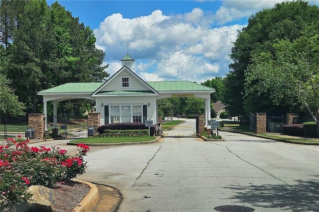 surrounding community featuring a gate and fence