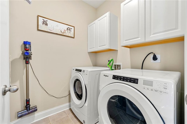 3735 Westhaven Dr, Cumming, GA 30040 - laundry area with cabinet space, washer and dryer, and light tile patterned floors