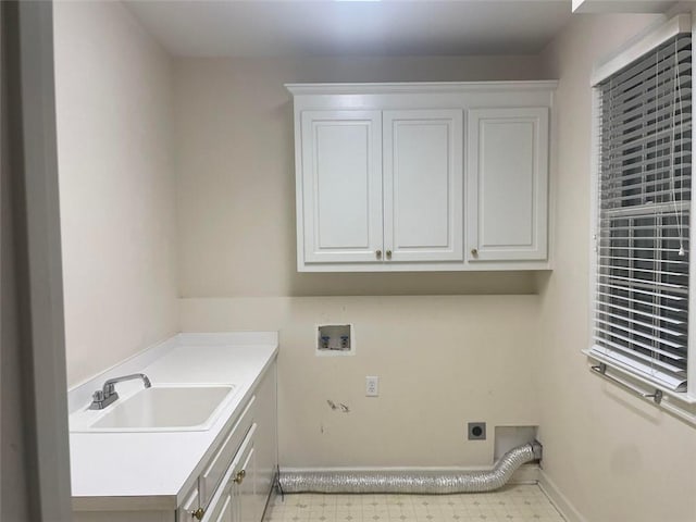 laundry room with light floors, hookup for a washing machine, cabinet space, a sink, and electric dryer hookup