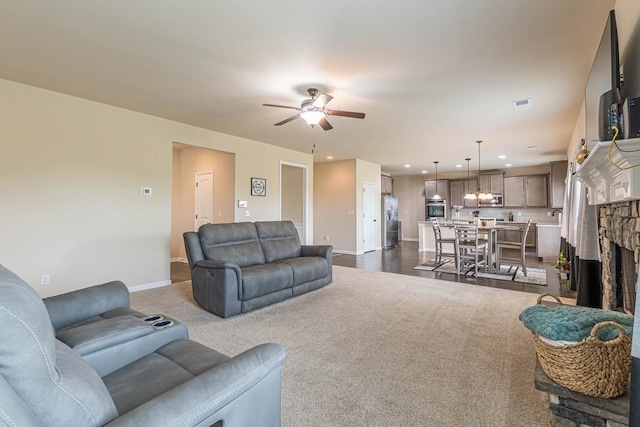 171 Osier Dr, Mcdonough, GA 30252 - living area featuring baseboards, ceiling fan, recessed lighting, and dark colored carpet