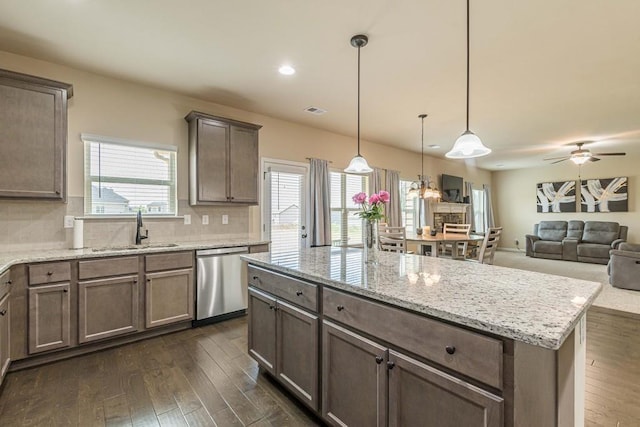 171 Osier Dr, Mcdonough, GA 30252 - kitchen with dishwasher, a sink, dark wood-style floors, decorative backsplash, and recessed lighting