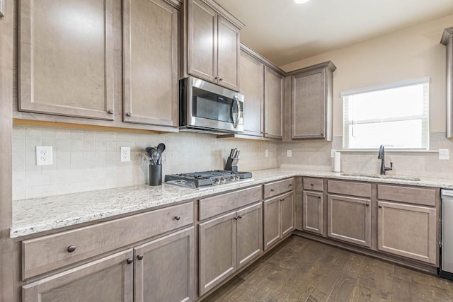 171 Osier Dr, Mcdonough, GA 30252 - kitchen with stainless steel appliances, a sink, dark wood-type flooring, and tasteful backsplash