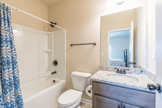 171 Osier Dr, Mcdonough, GA 30252 - ensuite bathroom with vanity, shower / bath combo, toilet, and baseboards