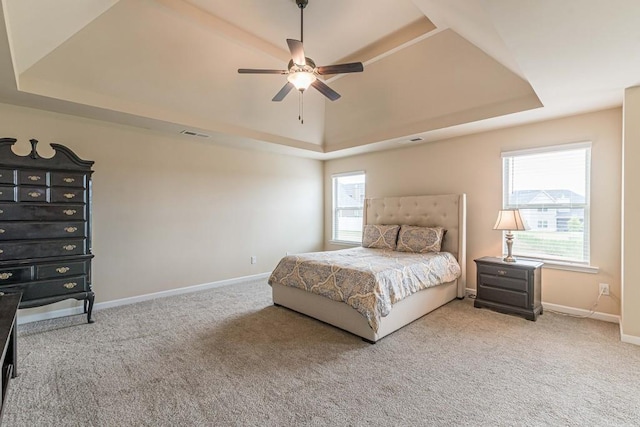 171 Osier Dr, Mcdonough, GA 30252 - carpeted bedroom with a tray ceiling, baseboards, and ceiling fan