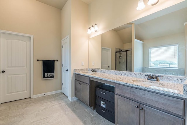 171 Osier Dr, Mcdonough, GA 30252 - full bath featuring double vanity, a stall shower, baseboards, and vaulted ceiling