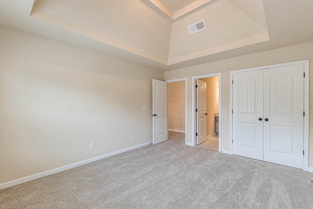 171 Osier Dr, Mcdonough, GA 30252 - unfurnished bedroom with light carpet, a raised ceiling, baseboards, and a closet