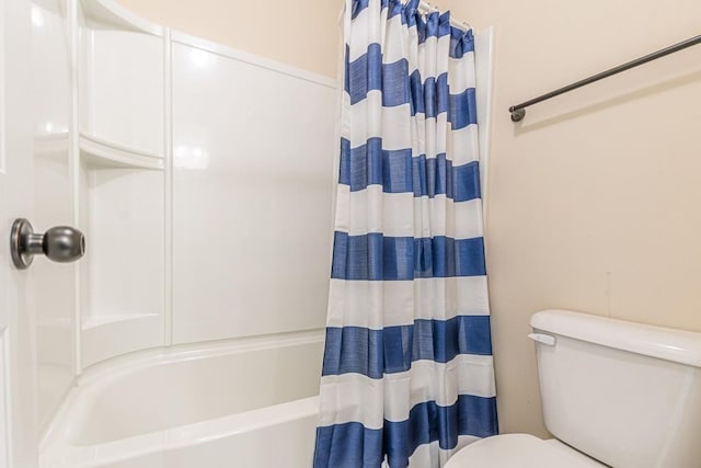 171 Osier Dr, Mcdonough, GA 30252 - bathroom featuring toilet and shower / bathtub combination with curtain