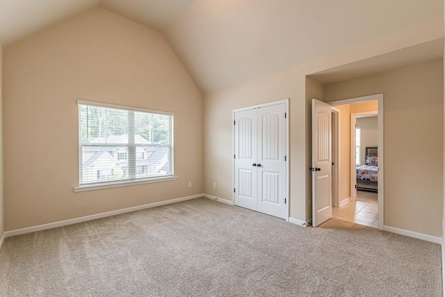 171 Osier Dr, Mcdonough, GA 30252 - unfurnished bedroom with carpet floors, lofted ceiling, baseboards, and a closet