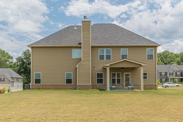 171 Osier Dr, Mcdonough, GA 30252 - back of property featuring a ceiling fan, a chimney, a lawn, a patio area, and cooling unit