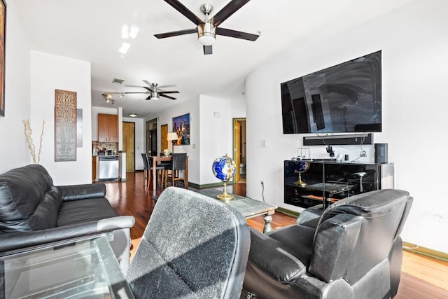 living room with hardwood / wood-style flooring and ceiling fan