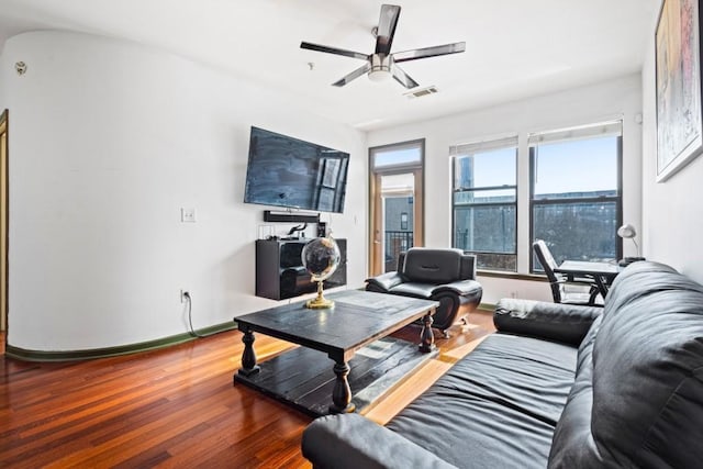 living room with ceiling fan and wood-type flooring