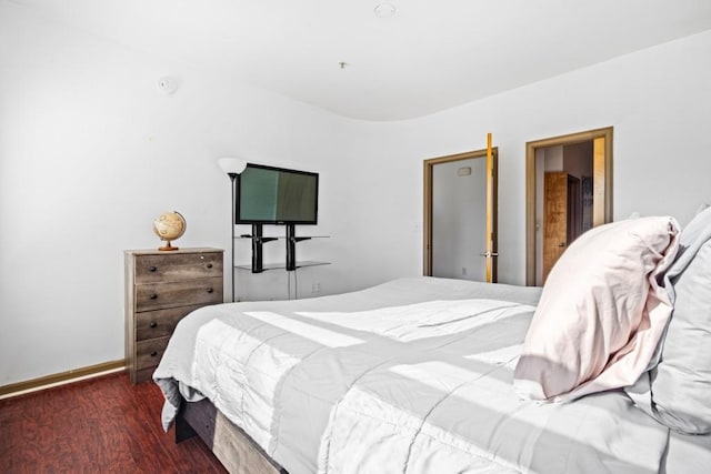 bedroom featuring dark wood-type flooring